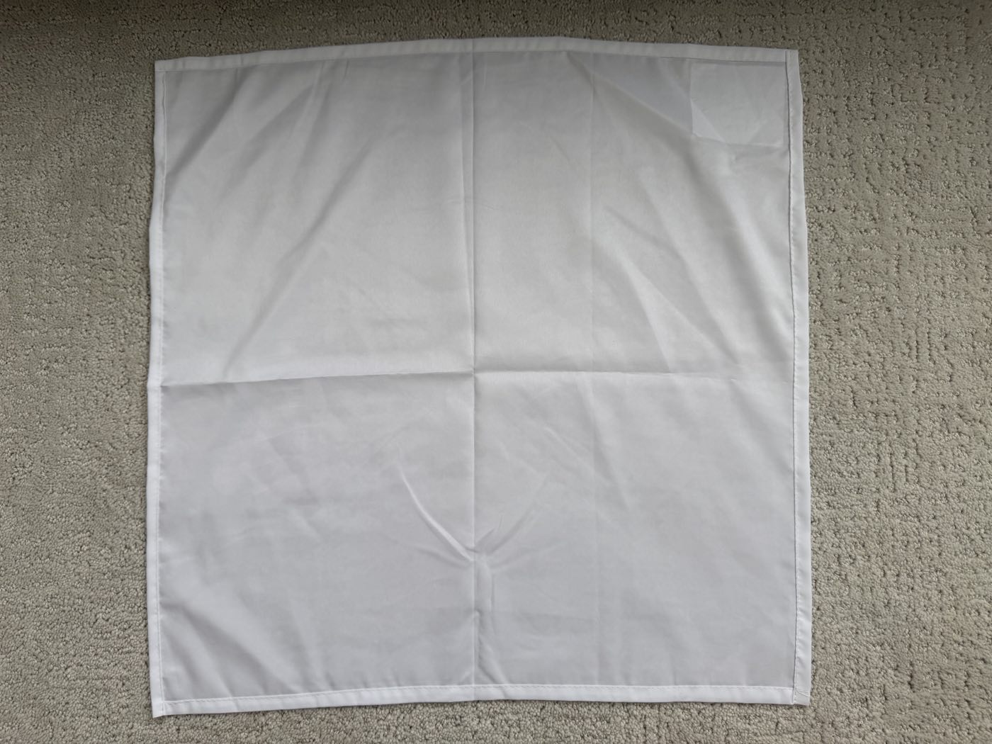 Square polyester pillow-cover blank, hemmed on all four sides with an envelope back